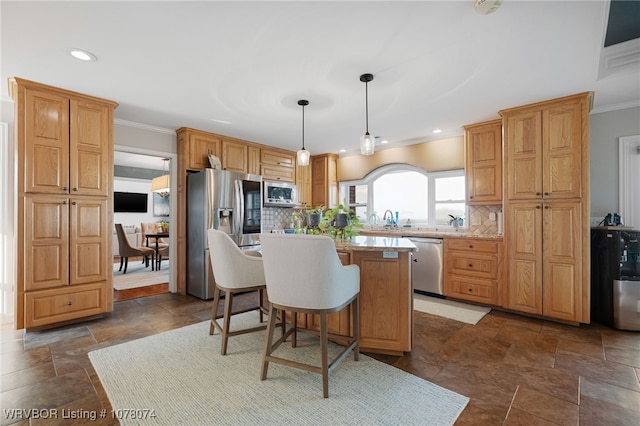 kitchen with decorative backsplash, a kitchen island, stainless steel appliances, and hanging light fixtures