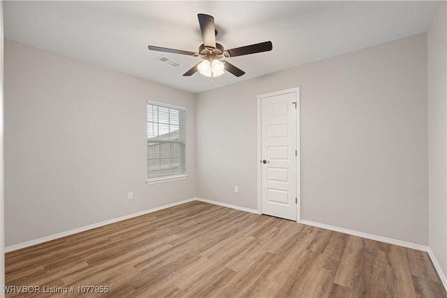 unfurnished room featuring ceiling fan and light hardwood / wood-style floors