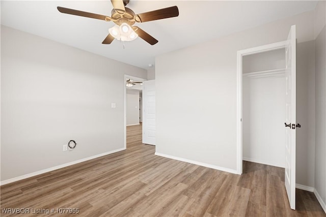 unfurnished bedroom with a closet, ceiling fan, and light hardwood / wood-style floors