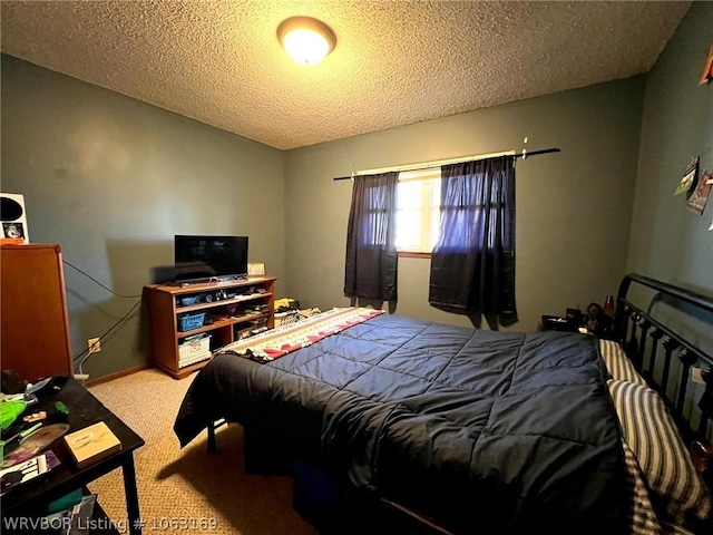 bedroom with light carpet and a textured ceiling