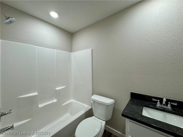 full bathroom with vanity, bathtub / shower combination, and toilet