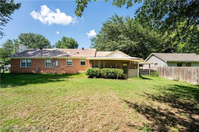 4300 Tilles Ave, Fort Smith, AR 72903 - back of property with a sunroom, brick siding, and a chimney