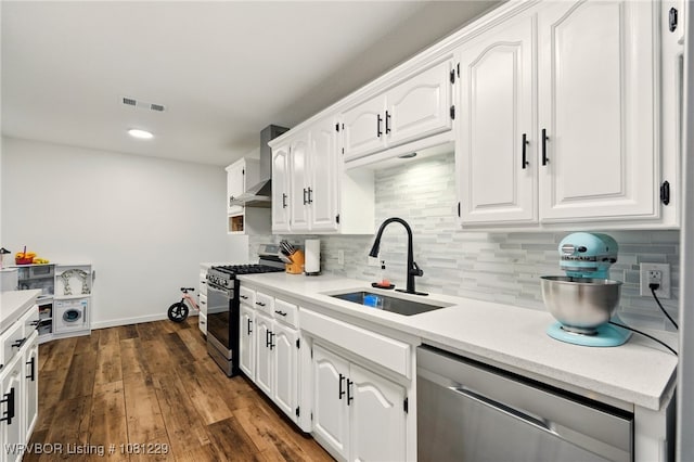 9010 Skypark Dr, Fort Smith, AR 72903 - kitchen with stainless steel appliances, a sink, white cabinets, backsplash, and recessed lighting