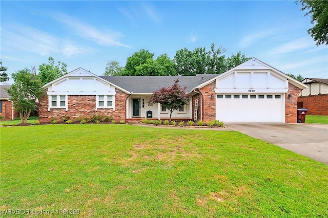 9010 Skypark Dr, Fort Smith, AR 72903 - view of front facade featuring an attached garage, driveway, a front yard, and brick siding