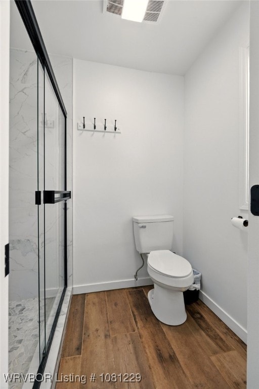 9010 Skypark Dr, Fort Smith, AR 72903 - full bathroom with toilet, a marble finish shower, wood finished floors, and baseboards