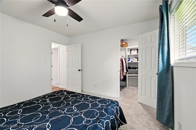 9010 Skypark Dr, Fort Smith, AR 72903 - bedroom featuring carpet, a spacious closet, and a ceiling fan