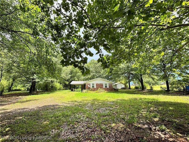 112463 S 4670th Rd, Gans, OK 74936 - view of grassy yard featuring a carport