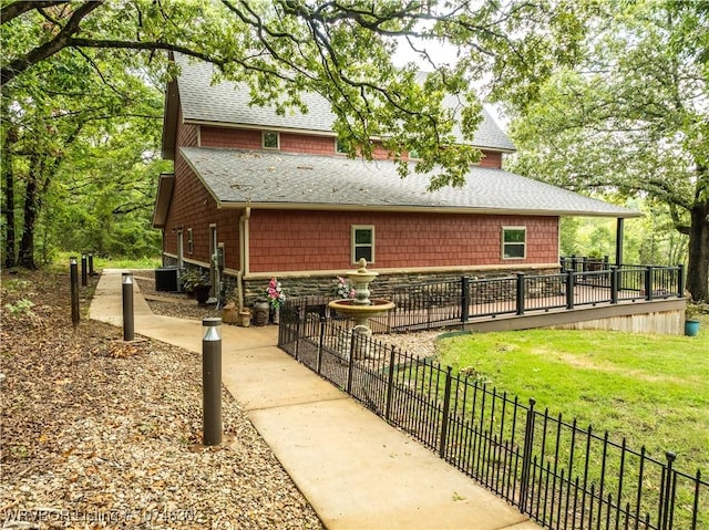 view of side of home featuring a yard