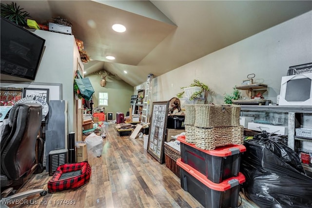 interior space with wood-type flooring and lofted ceiling