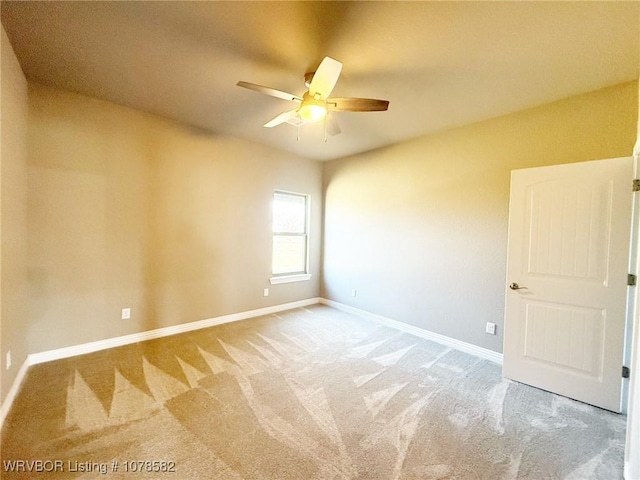 empty room with carpet floors and ceiling fan