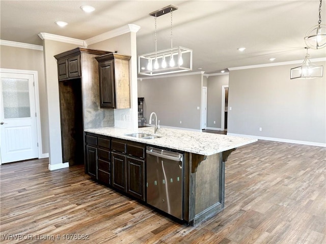 kitchen featuring pendant lighting, sink, a kitchen breakfast bar, dark brown cabinetry, and stainless steel dishwasher