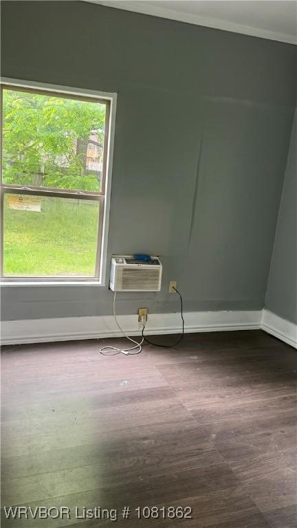 1101 N 6th St Unit A & B, Fort Smith, AR 72901 - unfurnished room featuring wood finished floors, an AC wall unit, and ornamental molding