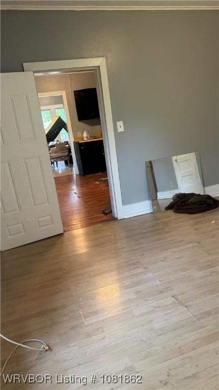 1101 N 6th St Unit A & B, Fort Smith, AR 72901 - hallway with light wood finished floors and ornamental molding
