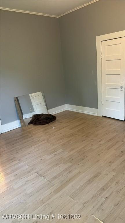 1101 N 6th St Unit A & B, Fort Smith, AR 72901 - spare room with crown molding and light wood-type flooring