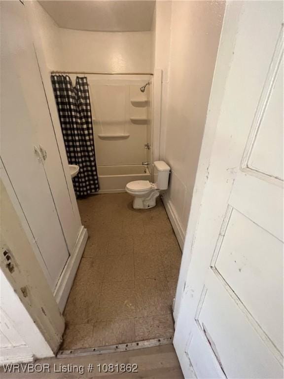 1101 N 6th St Unit A & B, Fort Smith, AR 72901 - bathroom with shower / bathtub combination with curtain and tile patterned floors