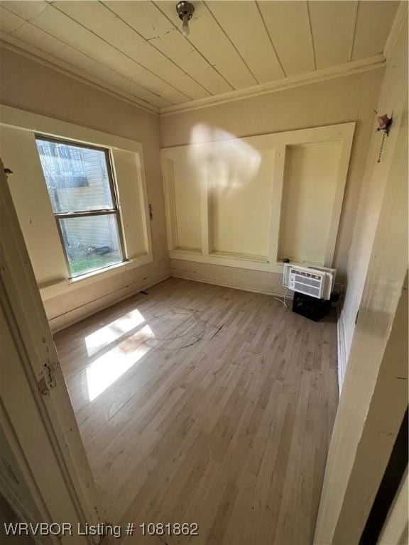 1101 N 6th St Unit A & B, Fort Smith, AR 72901 - unfurnished room with ornamental molding, an AC wall unit, and light wood-style floors