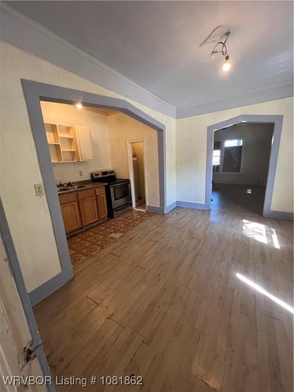 1101 N 6th St Unit A & B, Fort Smith, AR 72901 - kitchen with stainless steel electric range, wood finished floors, dark countertops, brown cabinetry, and open shelves