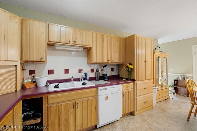 kitchen with backsplash, light brown cabinetry, dishwasher, and sink