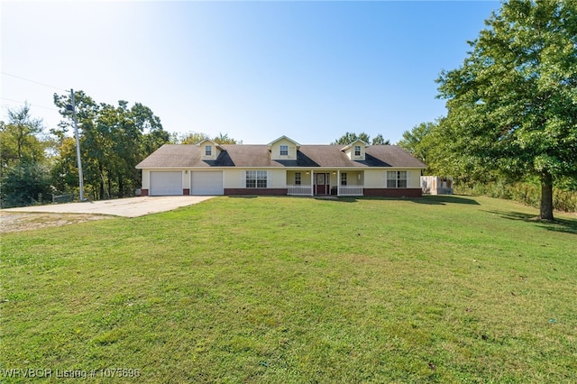 view of front of house featuring a front yard and a garage