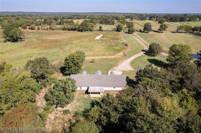 birds eye view of property with a rural view