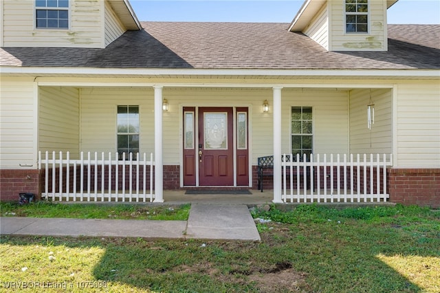 entrance to property featuring a porch