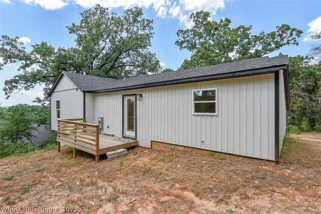 rear view of property with a deck