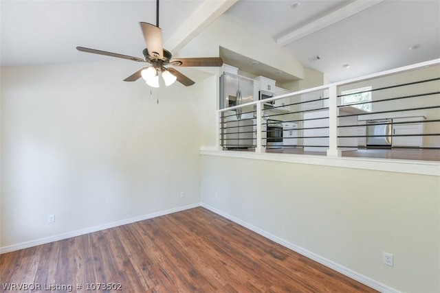 empty room featuring vaulted ceiling with beams, ceiling fan, and dark wood-type flooring