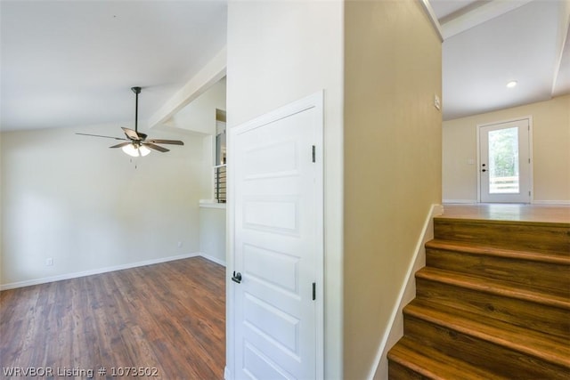 stairway featuring vaulted ceiling with beams, ceiling fan, and wood-type flooring