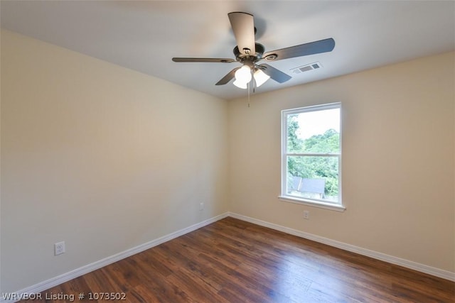 unfurnished room with ceiling fan and dark wood-type flooring