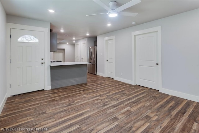 3305 Spradling Ave, Fort Smith, AR 72904 - unfurnished living room with dark wood-type flooring, ceiling fan, baseboards, and recessed lighting