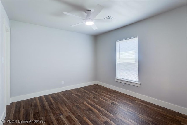 3305 Spradling Ave, Fort Smith, AR 72904 - spare room featuring dark wood finished floors, baseboards, and a ceiling fan