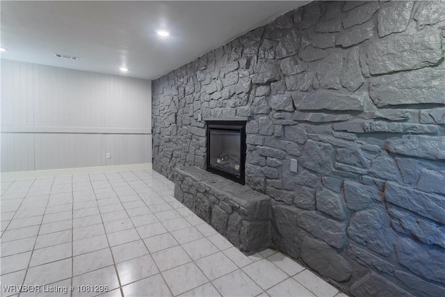 3305 Spradling Ave, Fort Smith, AR 72904 - unfurnished living room with a stone fireplace and tile patterned flooring