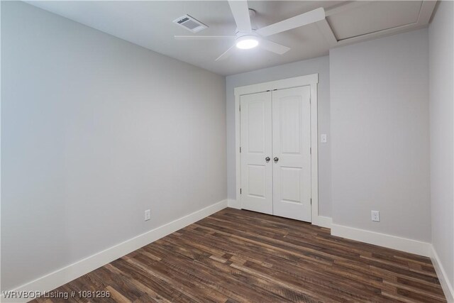 3305 Spradling Ave, Fort Smith, AR 72904 - unfurnished bedroom featuring baseboards, dark wood-type flooring, a closet, and ceiling fan