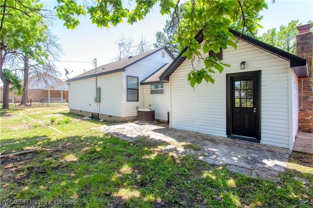 3305 Spradling Ave, Fort Smith, AR 72904 - rear view of property featuring central AC, a lawn, a patio area, and crawl space