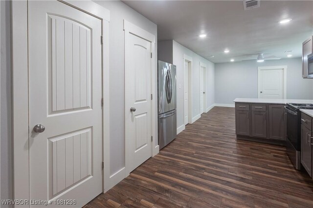 3305 Spradling Ave, Fort Smith, AR 72904 - kitchen with freestanding refrigerator, electric range oven, dark wood-type flooring, light countertops, and recessed lighting