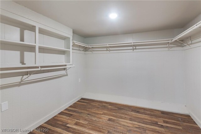 3305 Spradling Ave, Fort Smith, AR 72904 - walk in closet with dark wood-type flooring