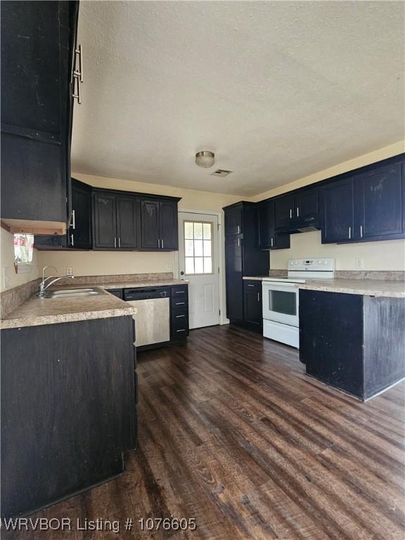 kitchen with a textured ceiling, sink, dishwasher, white electric range, and dark hardwood / wood-style floors