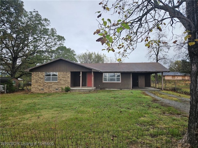 ranch-style house featuring a front yard and a carport