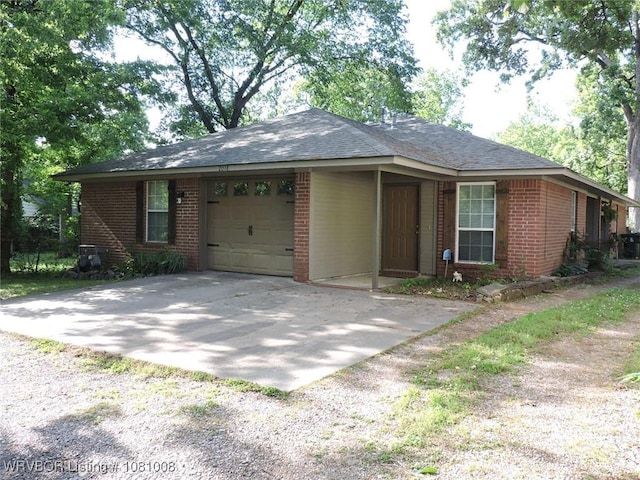 2016-2018 S V St, Fort Smith, AR 72901 - single story home featuring brick siding, gravel driveway, a garage, and a shingled roof