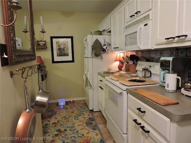 2016-2018 S V St, Fort Smith, AR 72901 - kitchen featuring white appliances, white cabinets, and baseboards