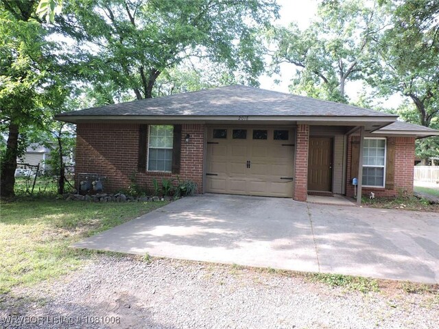 2016-2018 S V St, Fort Smith, AR 72901 - ranch-style house with driveway, an attached garage, brick siding, and fence