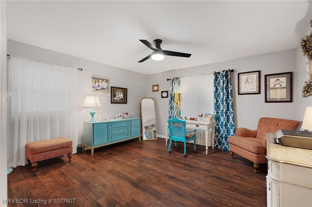 sitting room with ceiling fan and dark hardwood / wood-style flooring