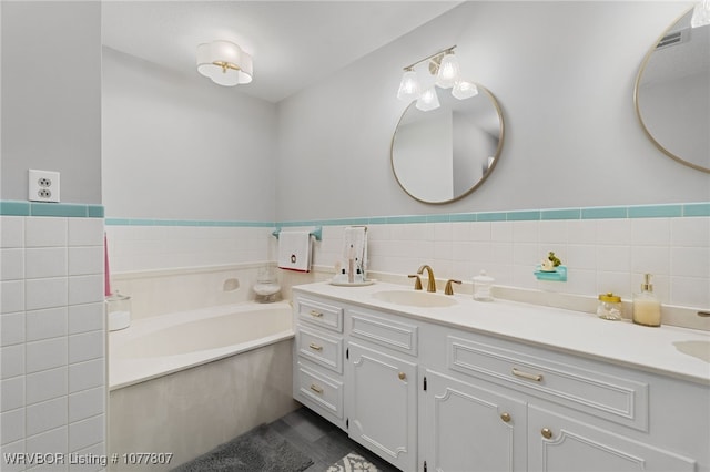 bathroom with vanity and a bathing tub