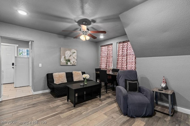 2101 Birnie Ave, Fort Smith, AR 72904 - living area featuring wood finished floors, ceiling fan, baseboards, a textured ceiling, and recessed lighting