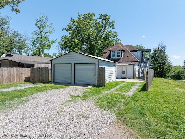2101 Birnie Ave, Fort Smith, AR 72904 - view of front facade featuring a garage, stairs, and an outdoor structure