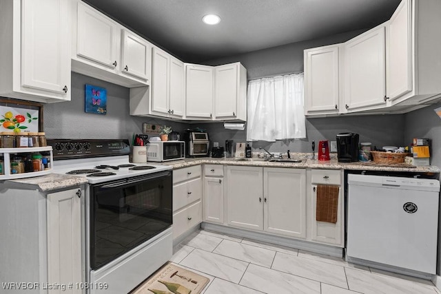 2101 Birnie Ave, Fort Smith, AR 72904 - kitchen featuring white appliances, white cabinetry, a sink, recessed lighting, and light marble finish flooring