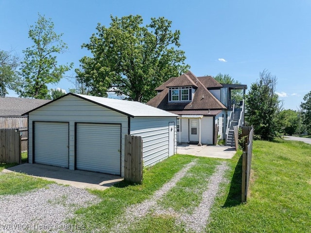 2101 Birnie Ave, Fort Smith, AR 72904 - view of front facade with an outbuilding, a detached garage, and stairway
