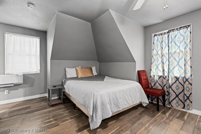 2101 Birnie Ave, Fort Smith, AR 72904 - bedroom with hardwood / wood-style flooring, a ceiling fan, baseboards, lofted ceiling, and multiple windows