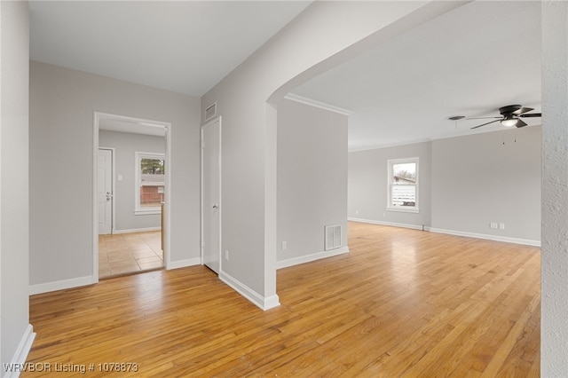 spare room featuring ceiling fan and light hardwood / wood-style floors