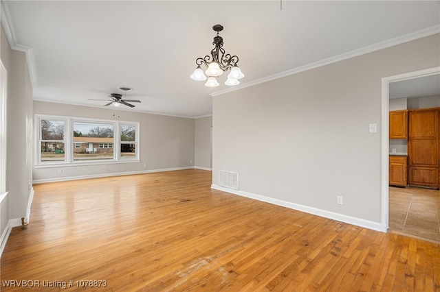 unfurnished room with ornamental molding, ceiling fan with notable chandelier, and light hardwood / wood-style flooring